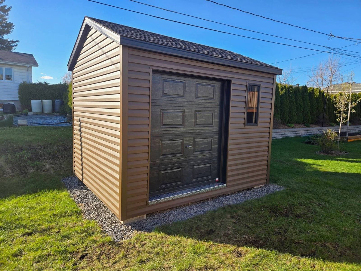 Brown shed with a garage door